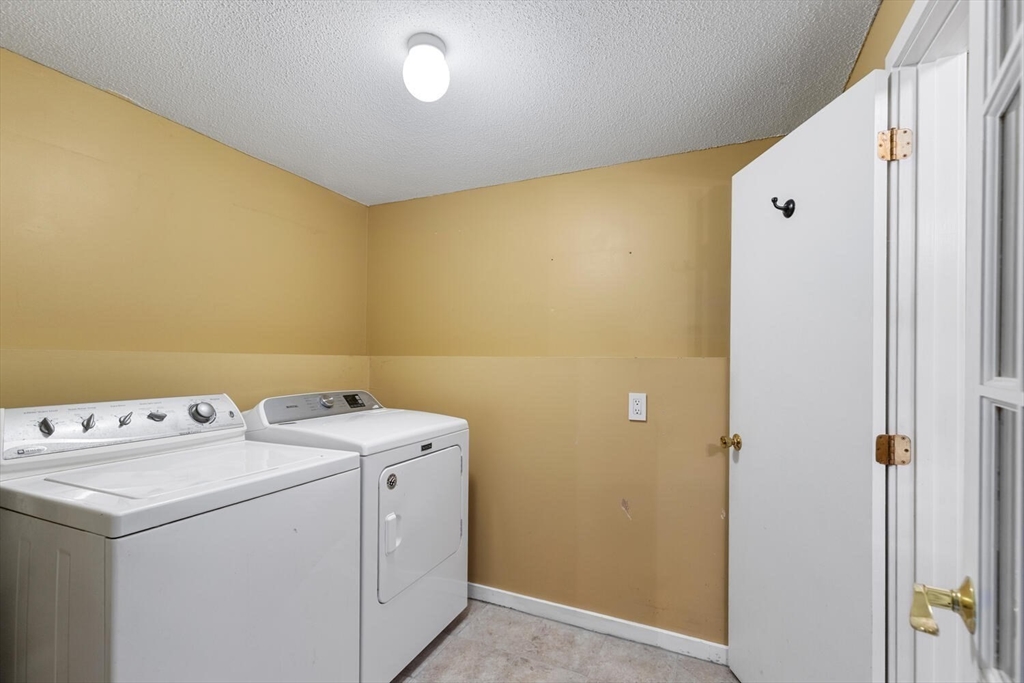 9 Fillmore Road, Unit 9C Salem, MA 01970 - Photo 22 of 22 a utility room with dryer and washer