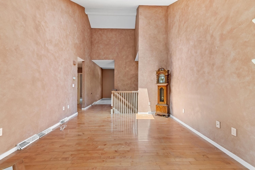 9 Fillmore Road, Unit 9C Salem, MA 01970 - Photo 6 of 22 a view of empty room with wooden floor