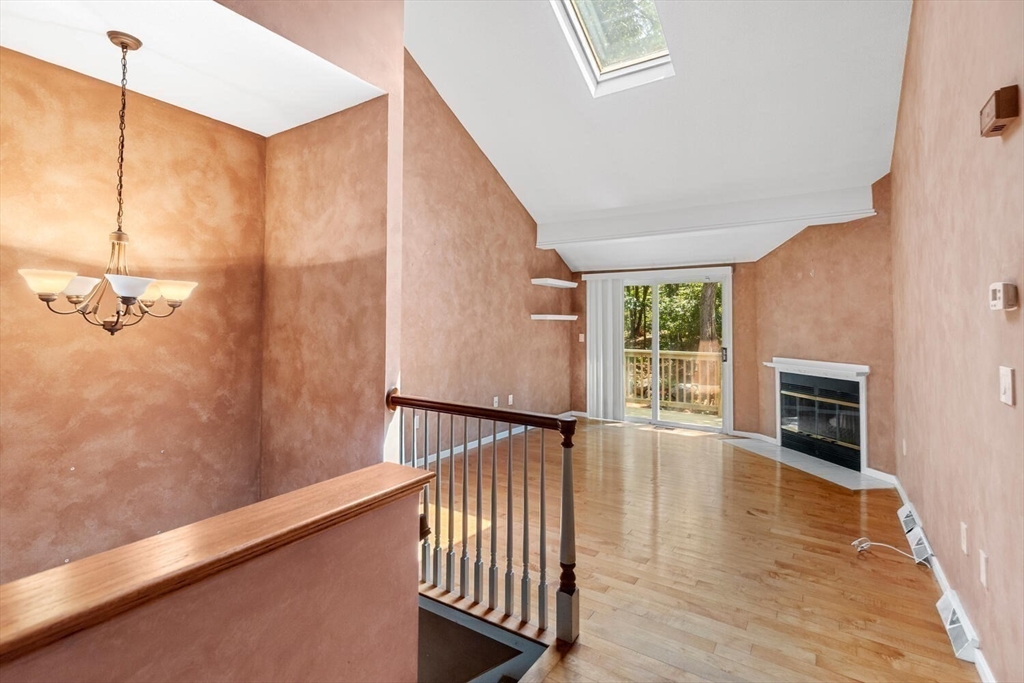 9 Fillmore Road, Unit 9C Salem, MA 01970 - Photo 9 of 22 a view of a hallway with wooden floor and staircase