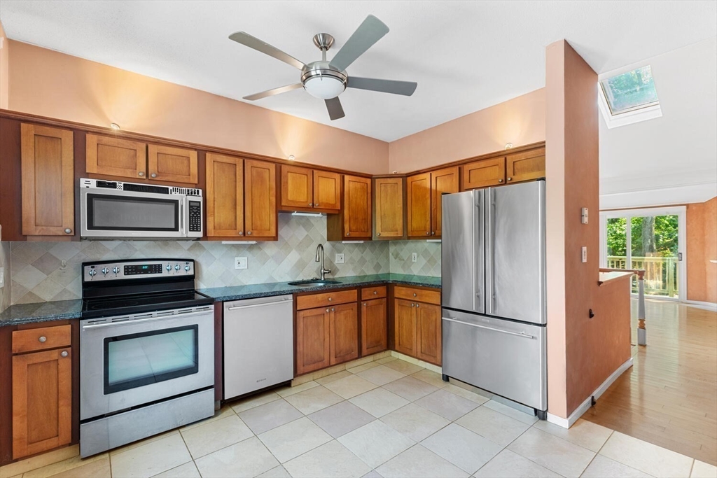 9 Fillmore Road, Unit 9C Salem, MA 01970 - Photo 10 of 22 a kitchen with stainless steel appliances granite countertop a refrigerator a stove a sink and dishwasher