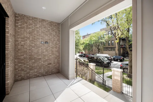 a large kitchen with stainless steel appliances a large counter tops and a wooden floors