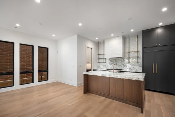 a bathroom with a double vanity sink mirror and toilet