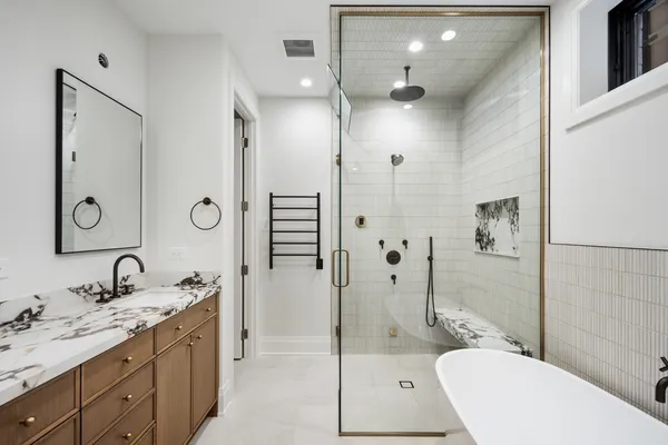 a bathroom with double sink and a mirror