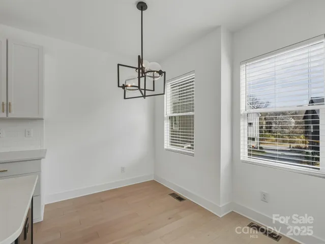 a view of empty room with windows