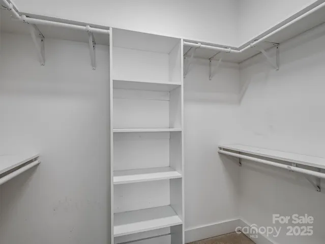 a view of an empty walk in closet