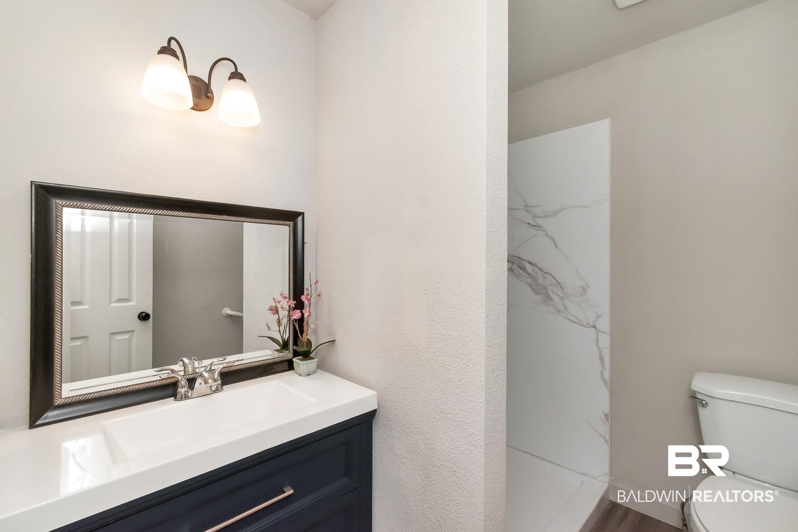 1334 Leroy Stevens Road Mobile, AL 36695 - Photo 26 of 46 Full bathroom with vanity and a marble finish shower