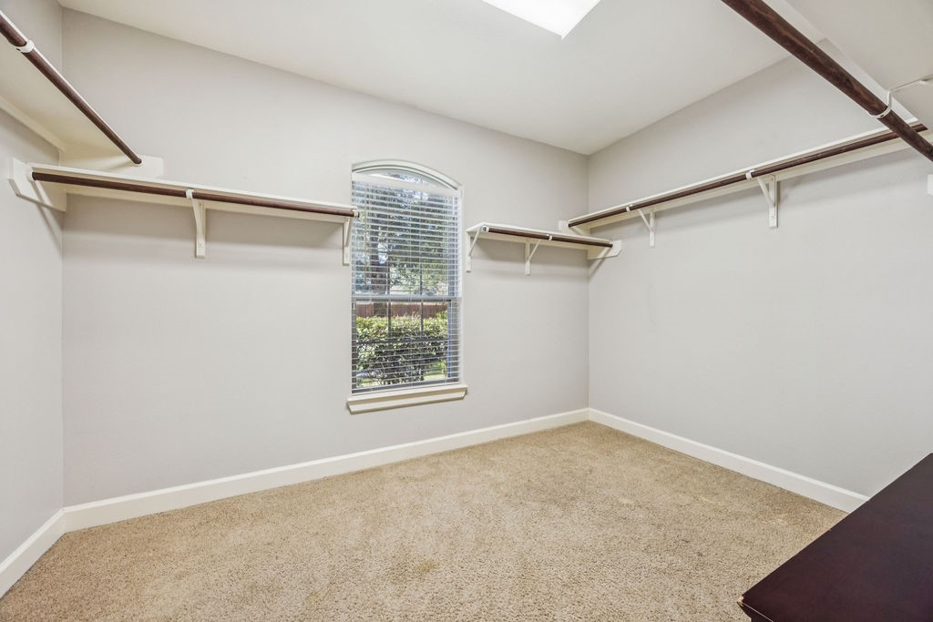 31306 Summit Grove Lane Spring, TX 77386 - Photo 13 of 45 a view of a room with rack on the wall and a window