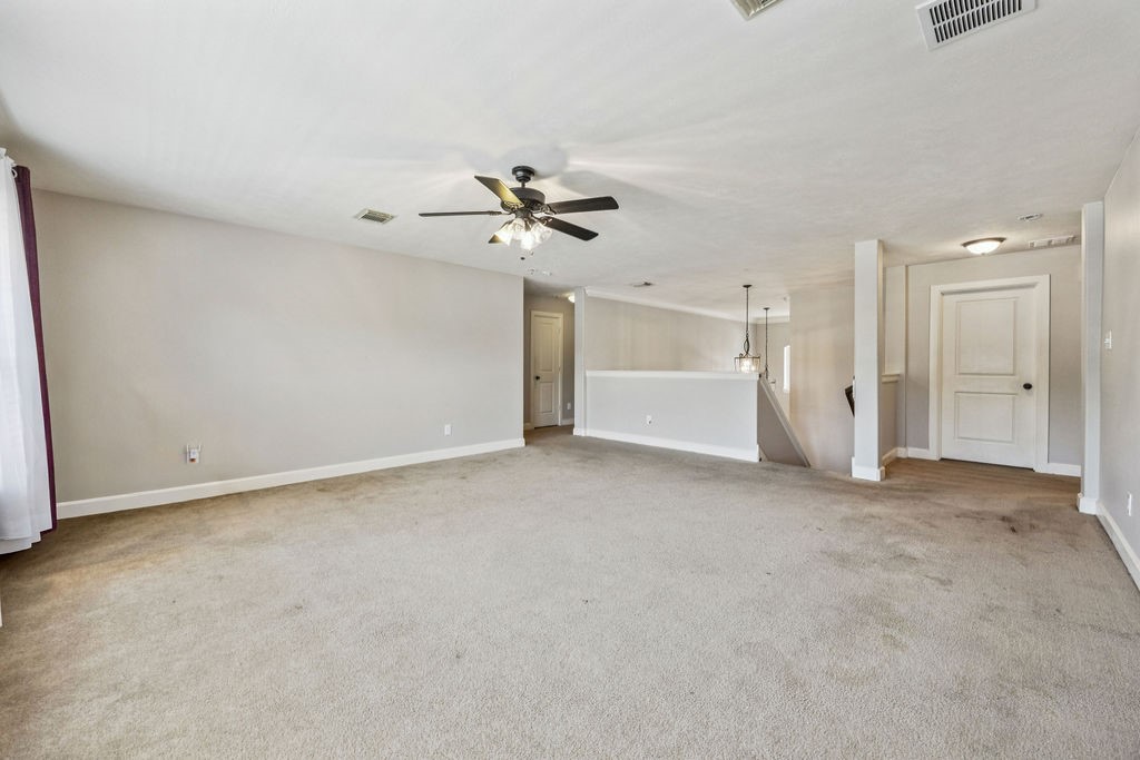 31306 Summit Grove Lane Spring, TX 77386 - Photo 16 of 45 a view of an empty room with a ceiling fan