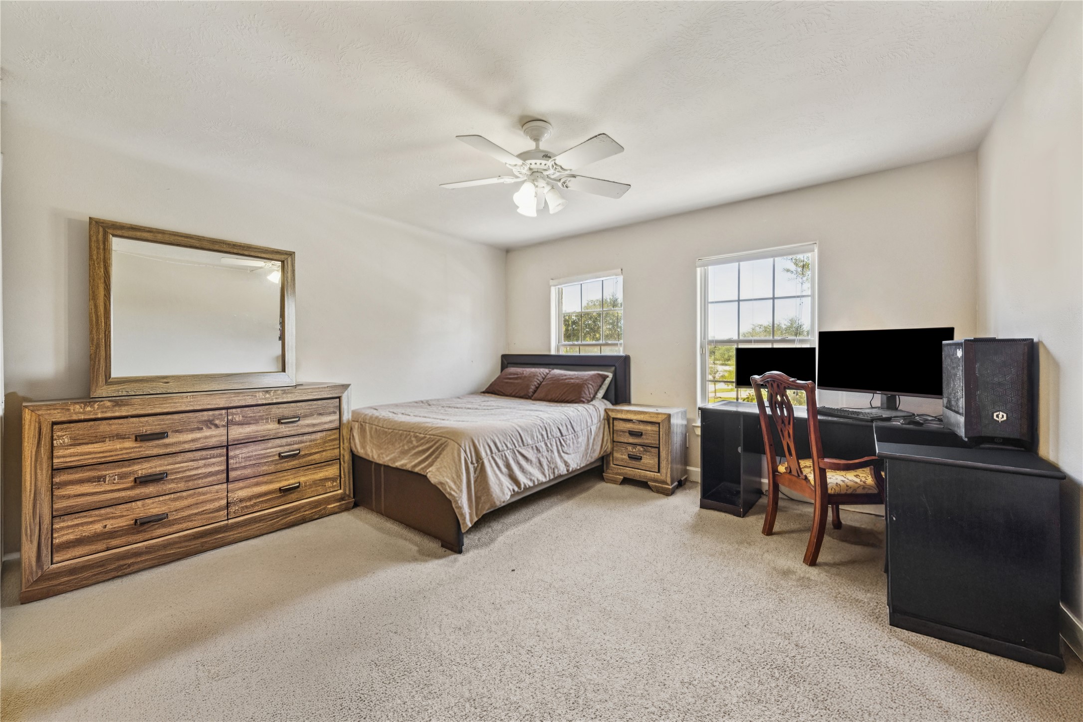 31306 Summit Grove Lane Spring, TX 77386 - Photo 20 of 45 a bedroom with a bed and a couch