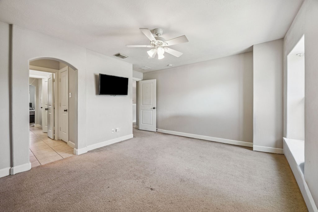 31306 Summit Grove Lane Spring, TX 77386 - Photo 22 of 45 a view of a livingroom with a ceiling fan and window