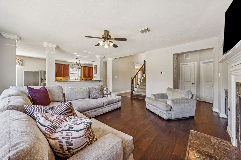 31306 Summit Grove Lane Spring, TX 77386 - Photo 9 of 45 a living room with furniture and a flat screen tv