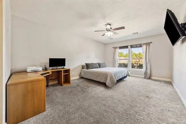 a view of a hallway with staircase