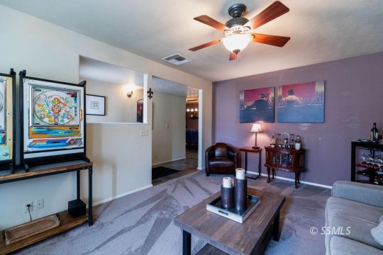 908 North Inyo Street Ridgecrest, CA 93555 - Photo 8 of 46 a living room with furniture and wooden floor