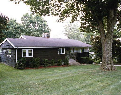 503 Valley Road Fairfield, CT 06825 - Photo 1 of 1 a front view of a house with garden