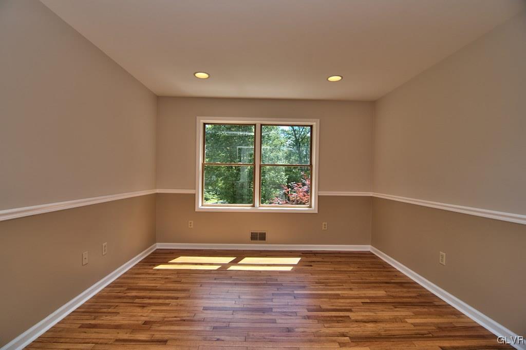 4913 Pine Ridge Drive West Bushkill, PA 18324 - Photo 16 of 50 The family room features solid hardwood floors and