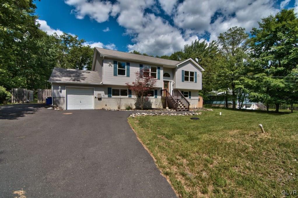 4913 Pine Ridge Drive West Bushkill, PA 18324 - Photo 2 of 50 The home features a fully paved driveway and is se