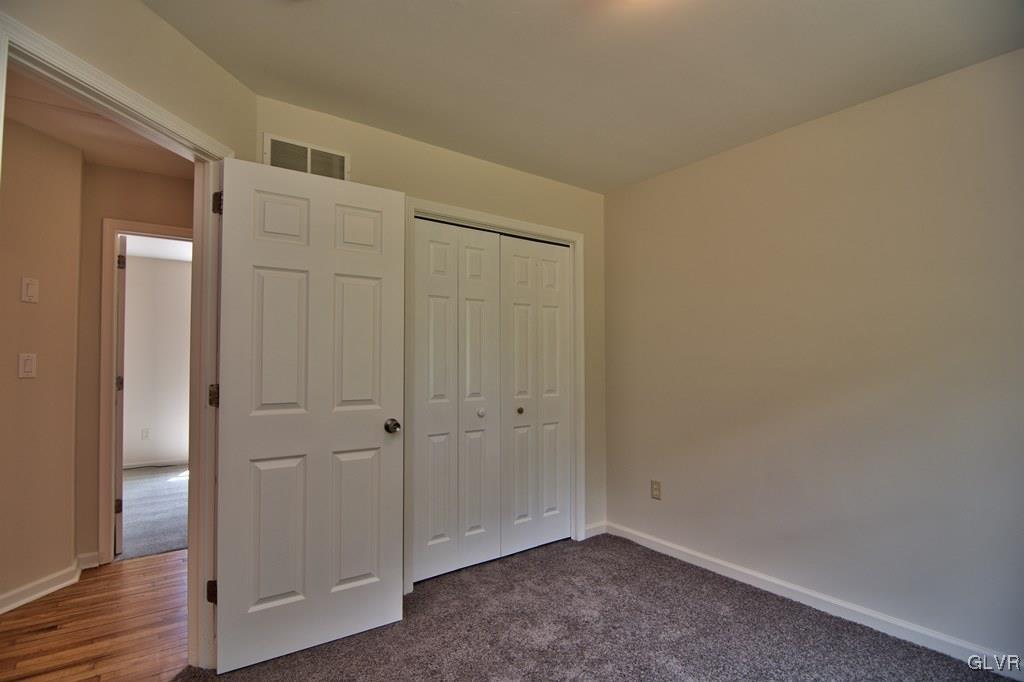 4913 Pine Ridge Drive West Bushkill, PA 18324 - Photo 20 of 50 Bedroom 2 is yard-facing, has a dbl closet & can f