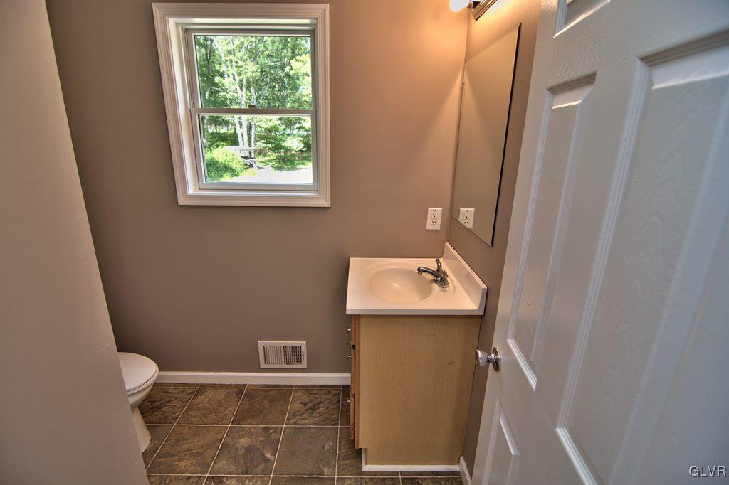 4913 Pine Ridge Drive West Bushkill, PA 18324 - Photo 23 of 50 The 1st floor half bath has a new vinyl floor and
