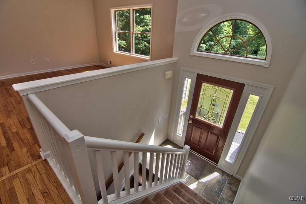 4913 Pine Ridge Drive West Bushkill, PA 18324 - Photo 3 of 50 View of the entry foyer w/ vinyl floor, carpeted s