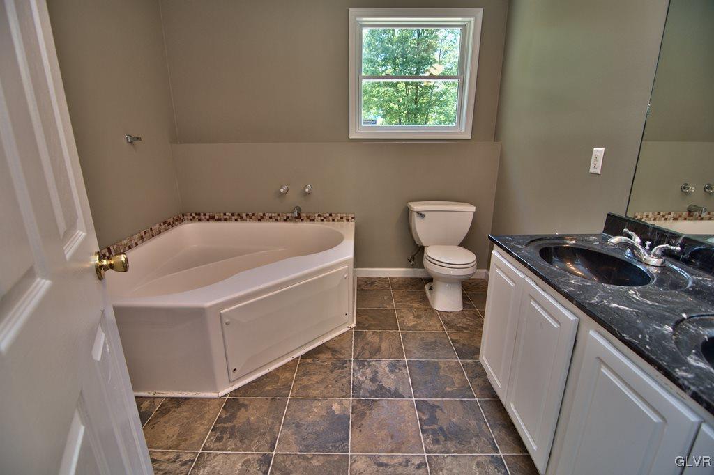 4913 Pine Ridge Drive West Bushkill, PA 18324 - Photo 30 of 50 View of the spacious master bath w/ vinyl floor an