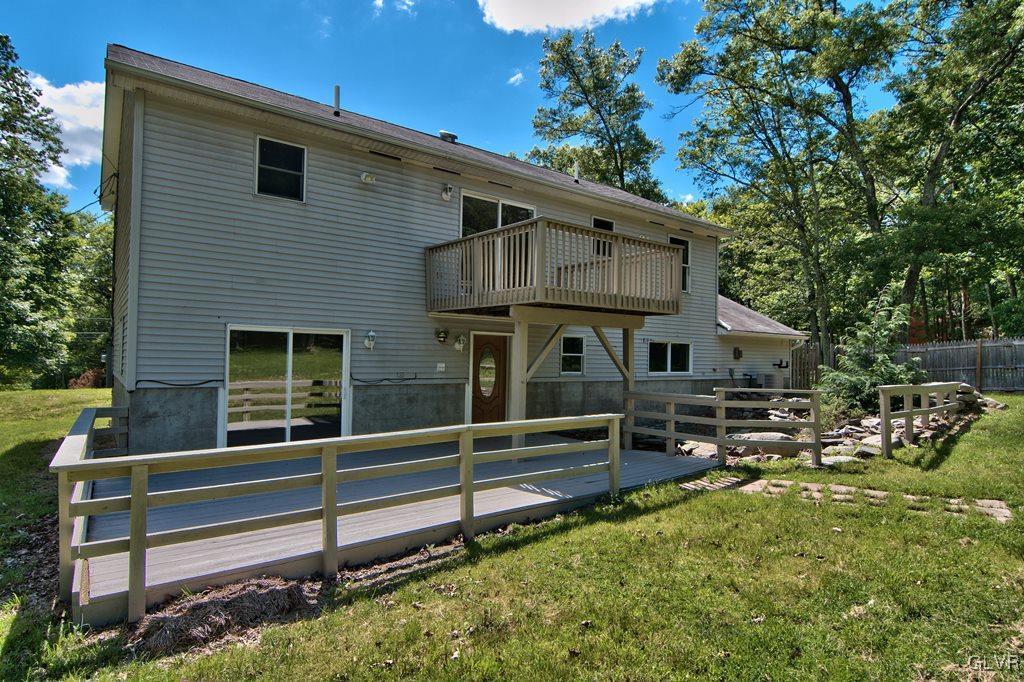 4913 Pine Ridge Drive West Bushkill, PA 18324 - Photo 42 of 50 View of the back of the house w/ upper deck leadin