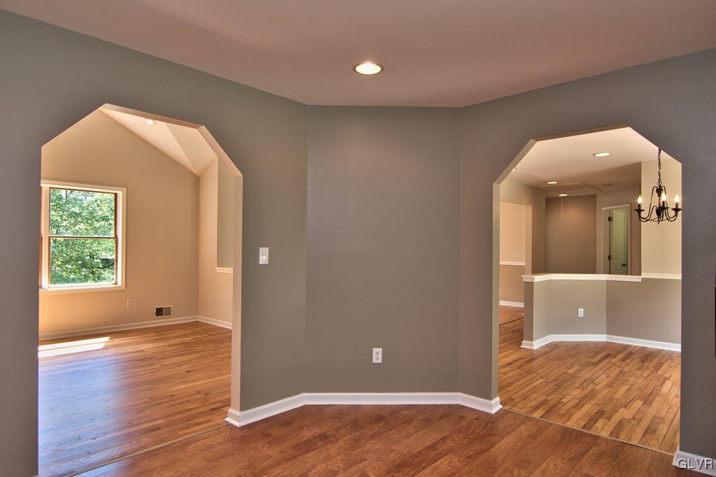 4913 Pine Ridge Drive West Bushkill, PA 18324 - Photo 10 of 50 Archways from the kitchen leading to the living an