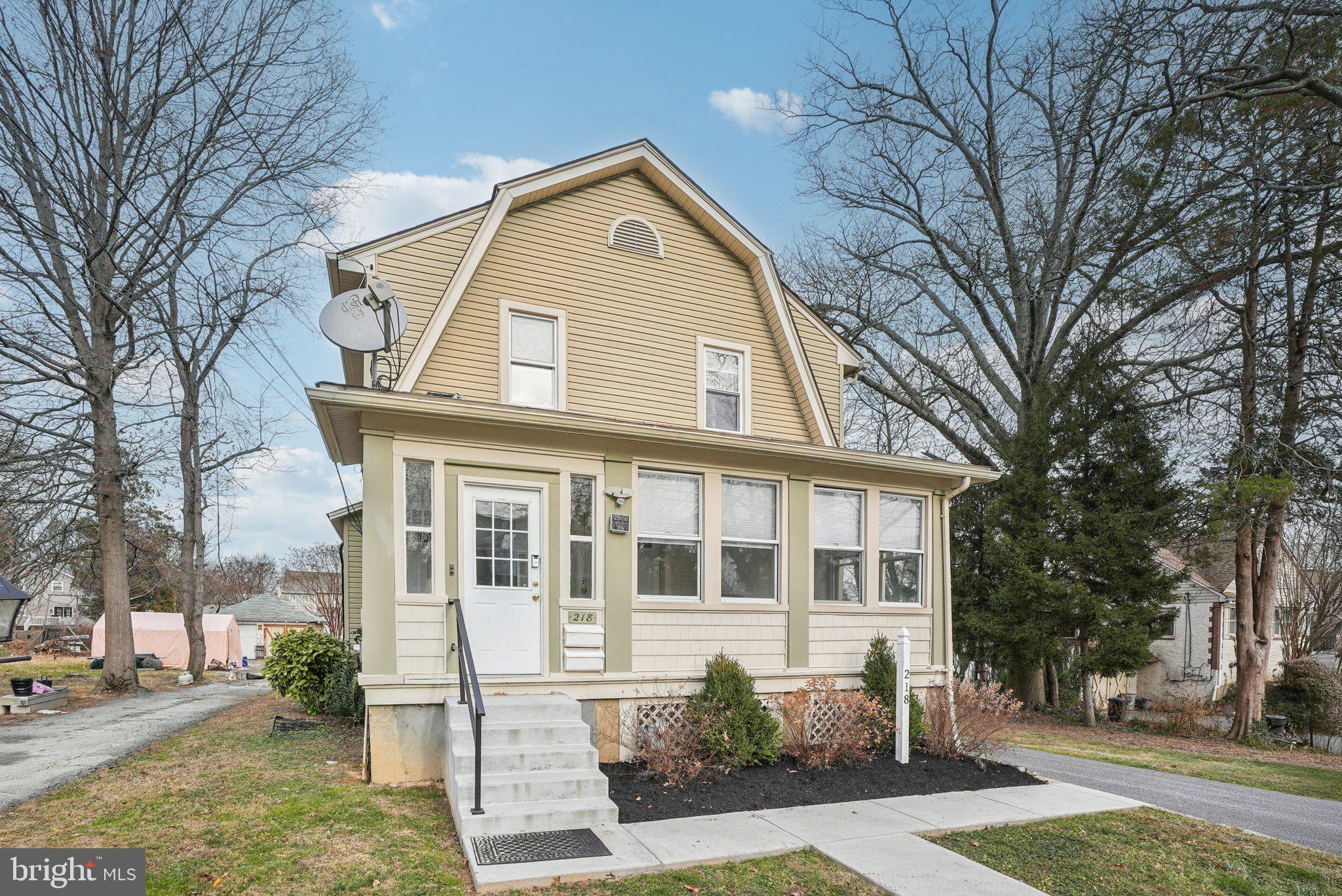 216-218 President Avenue Rutledge, PA 19070 - Photo 2 of 54 a front view of a house with a yard