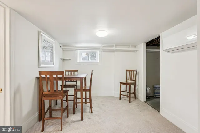 a view of a livingroom with furniture and a window