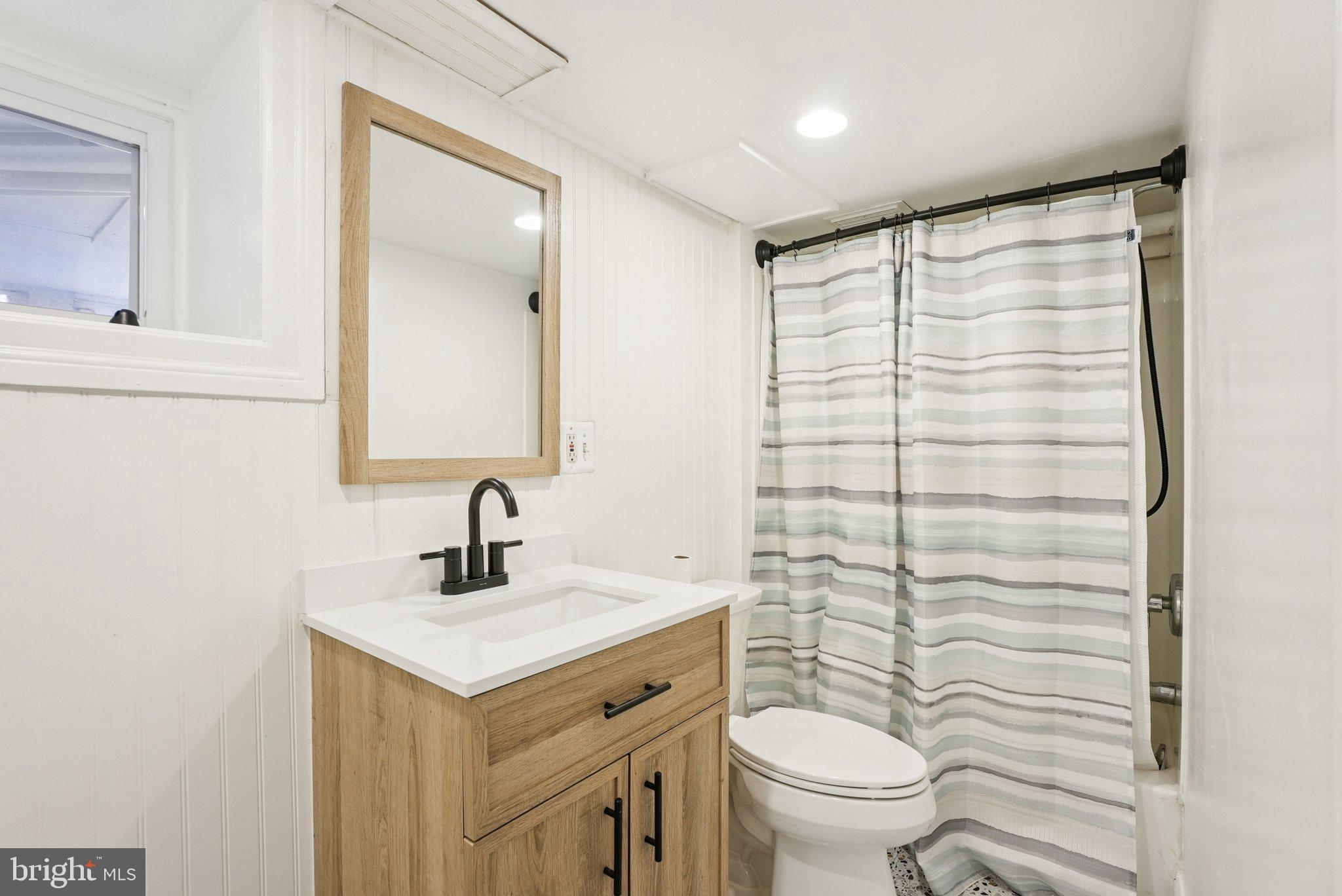 216-218 President Avenue Rutledge, PA 19070 - Photo 28 of 54 a bathroom with a sink toilet and shower
