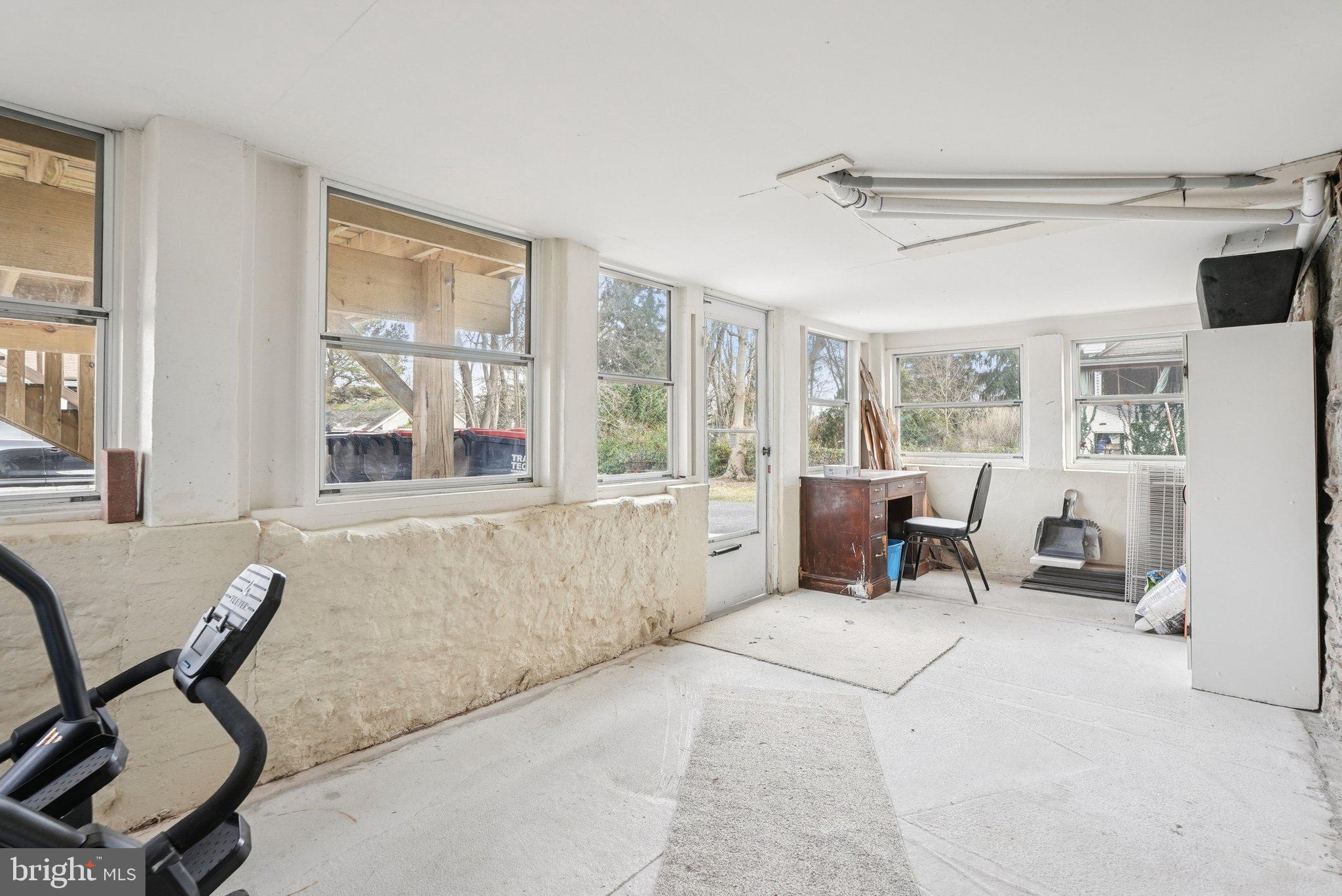 216-218 President Avenue Rutledge, PA 19070 - Photo 30 of 54 a living room with furniture and a large window