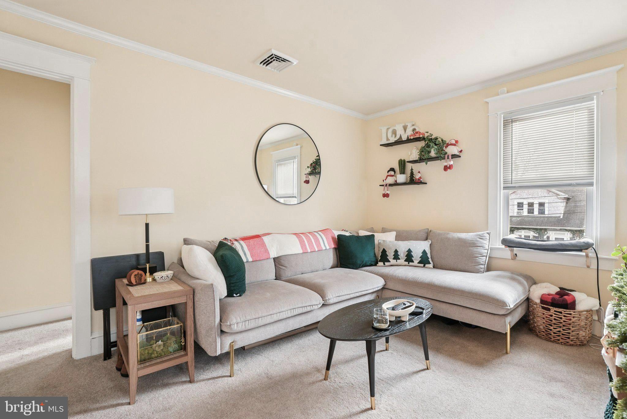 216-218 President Avenue Rutledge, PA 19070 - Photo 32 of 54 a living room with furniture a lamp and a window
