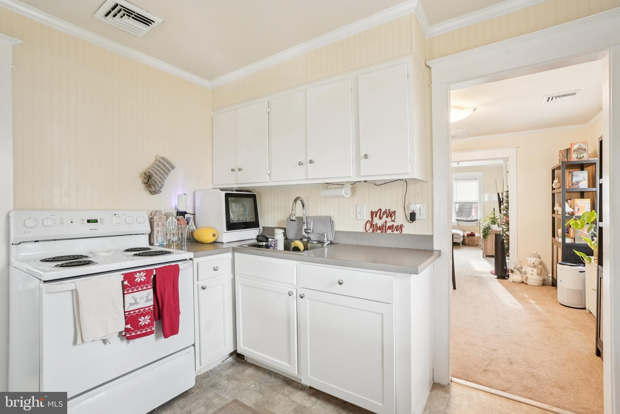 216-218 President Avenue Rutledge, PA 19070 - Photo 35 of 54 a kitchen with stainless steel appliances granite countertop a stove and a sink