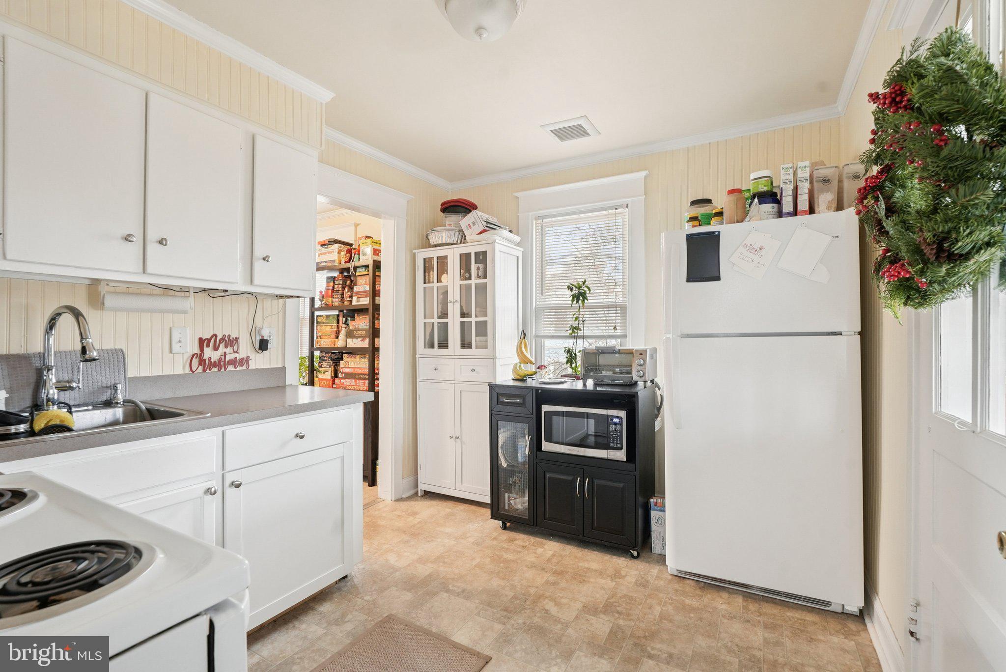 216-218 President Avenue Rutledge, PA 19070 - Photo 36 of 54 a kitchen with a refrigerator and a sink