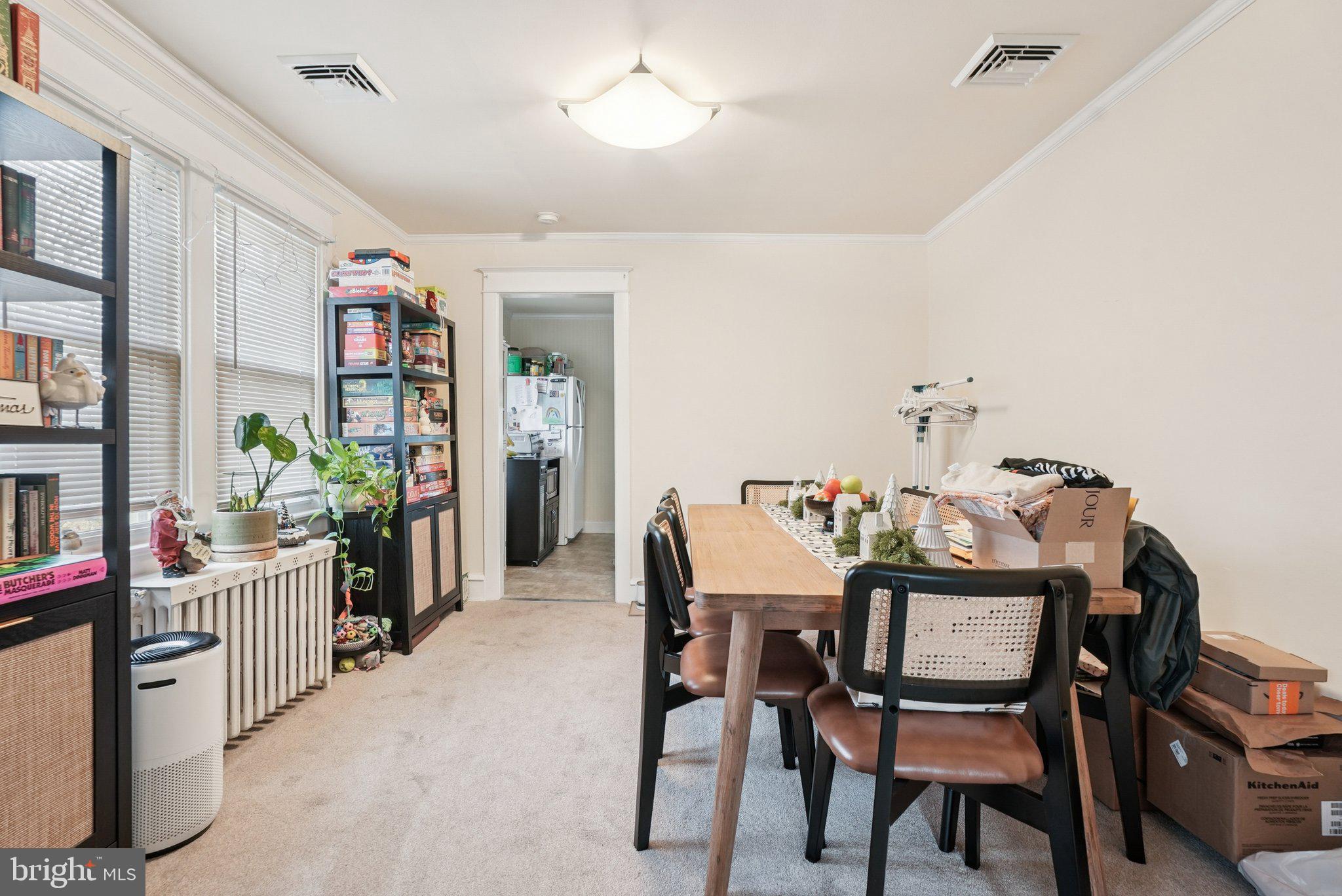 216-218 President Avenue Rutledge, PA 19070 - Photo 39 of 54 a dining room with furniture and a potted plant
