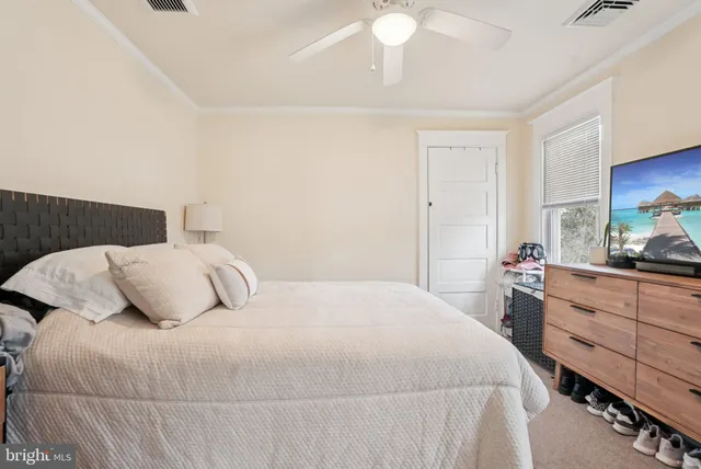 a view of a entryway with wooden floor and cabinet