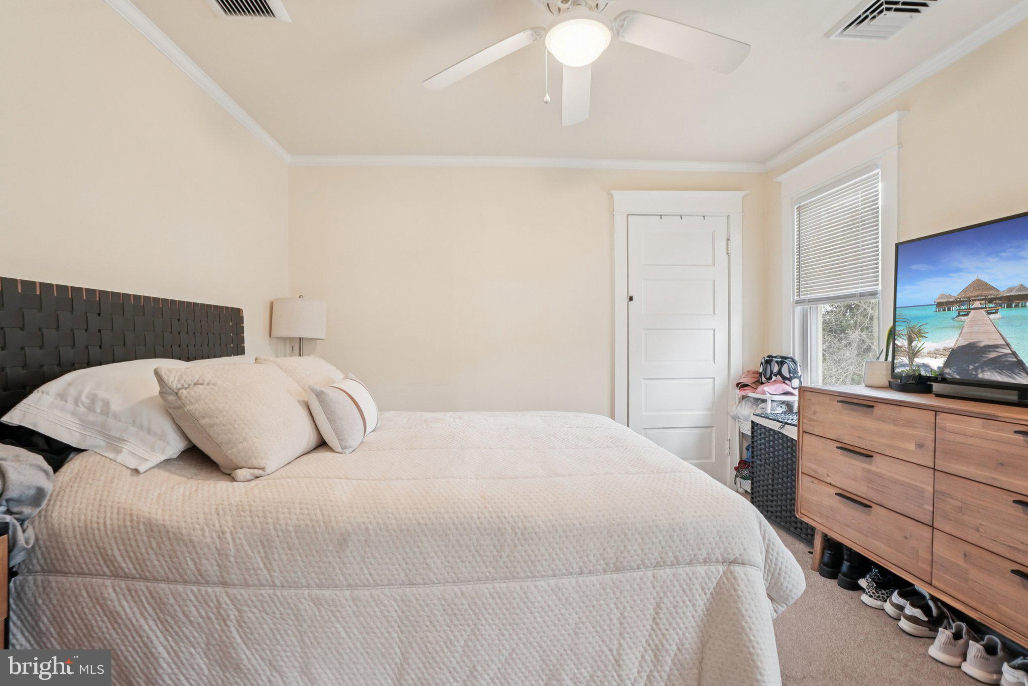 216-218 President Avenue Rutledge, PA 19070 - Photo 42 of 54 a bedroom with a bed and a chandelier