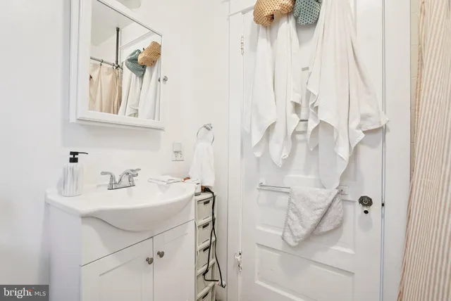 a view of a house with a door and wooden floor