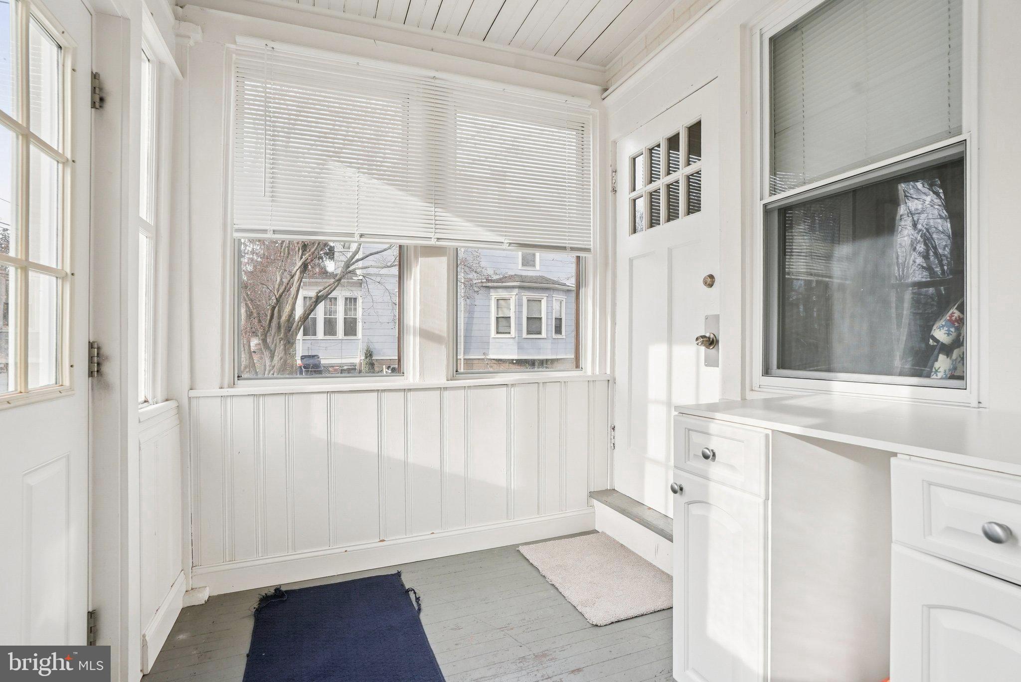 216-218 President Avenue Rutledge, PA 19070 - Photo 45 of 54 a view of a entryway with wooden floor and cabinet