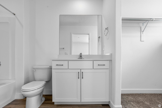 2194 Wolverine Way, Unit 2531 Washington, UT 84780 - Photo 26 of 52 Bathroom vanity featuring a white cabinet base, dual drawers, and a built-in sink with a reflective mirror