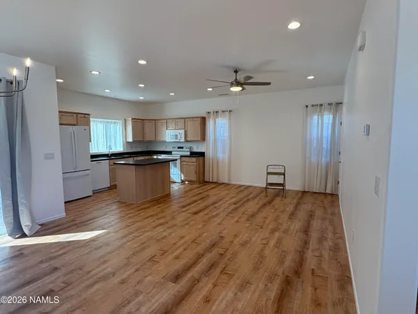 a view of kitchen with wooden floor