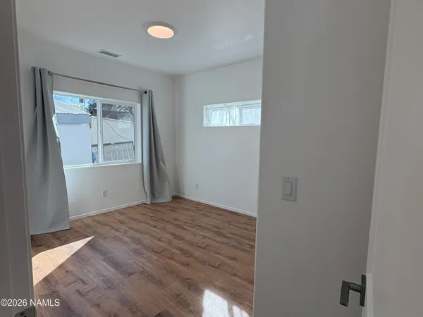 a view of an empty room with a window