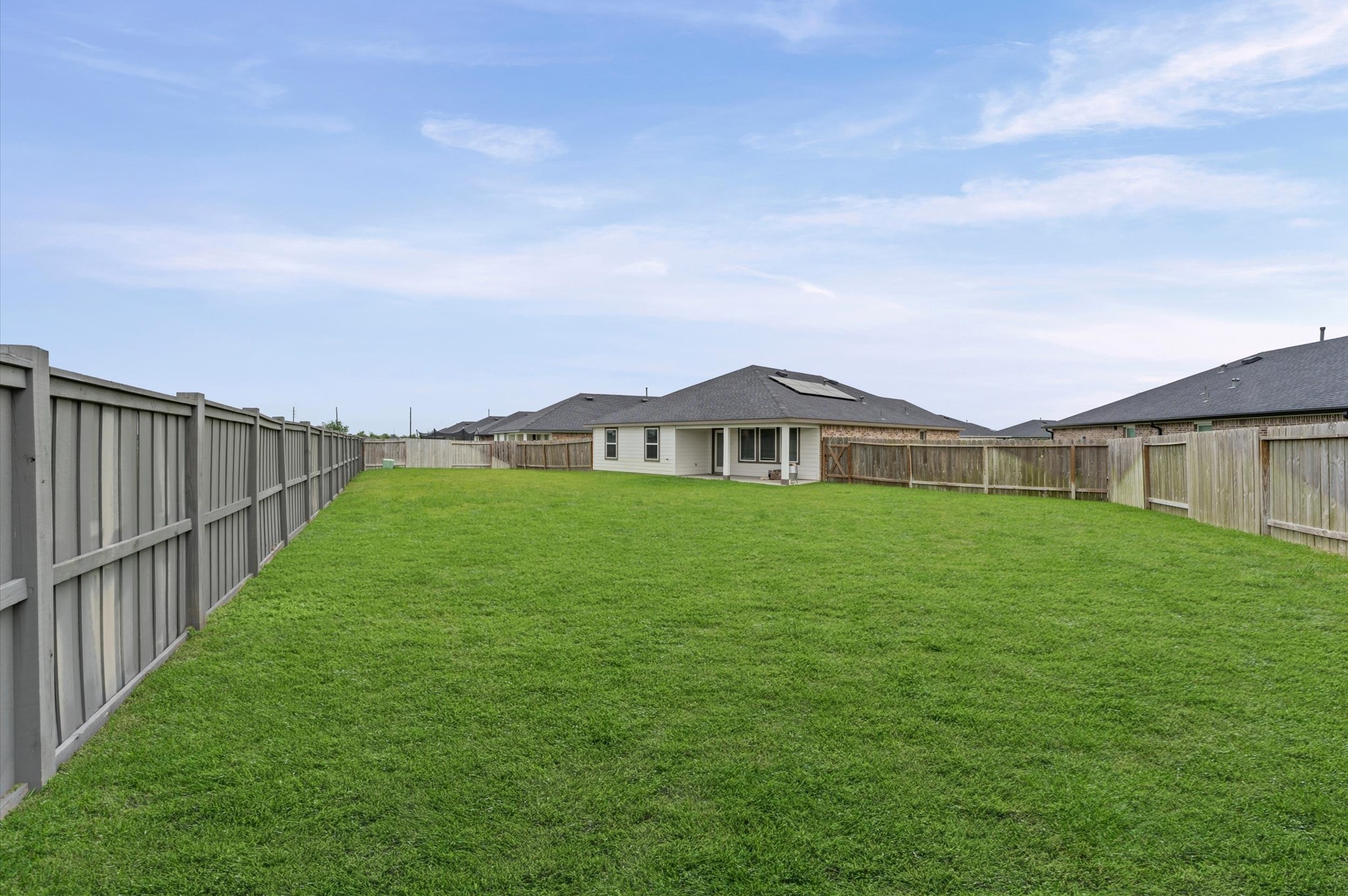 903 Curly Angora Court Rosharon, TX 77583 - Photo 25 of 30 Backyard includes sprinkler system.