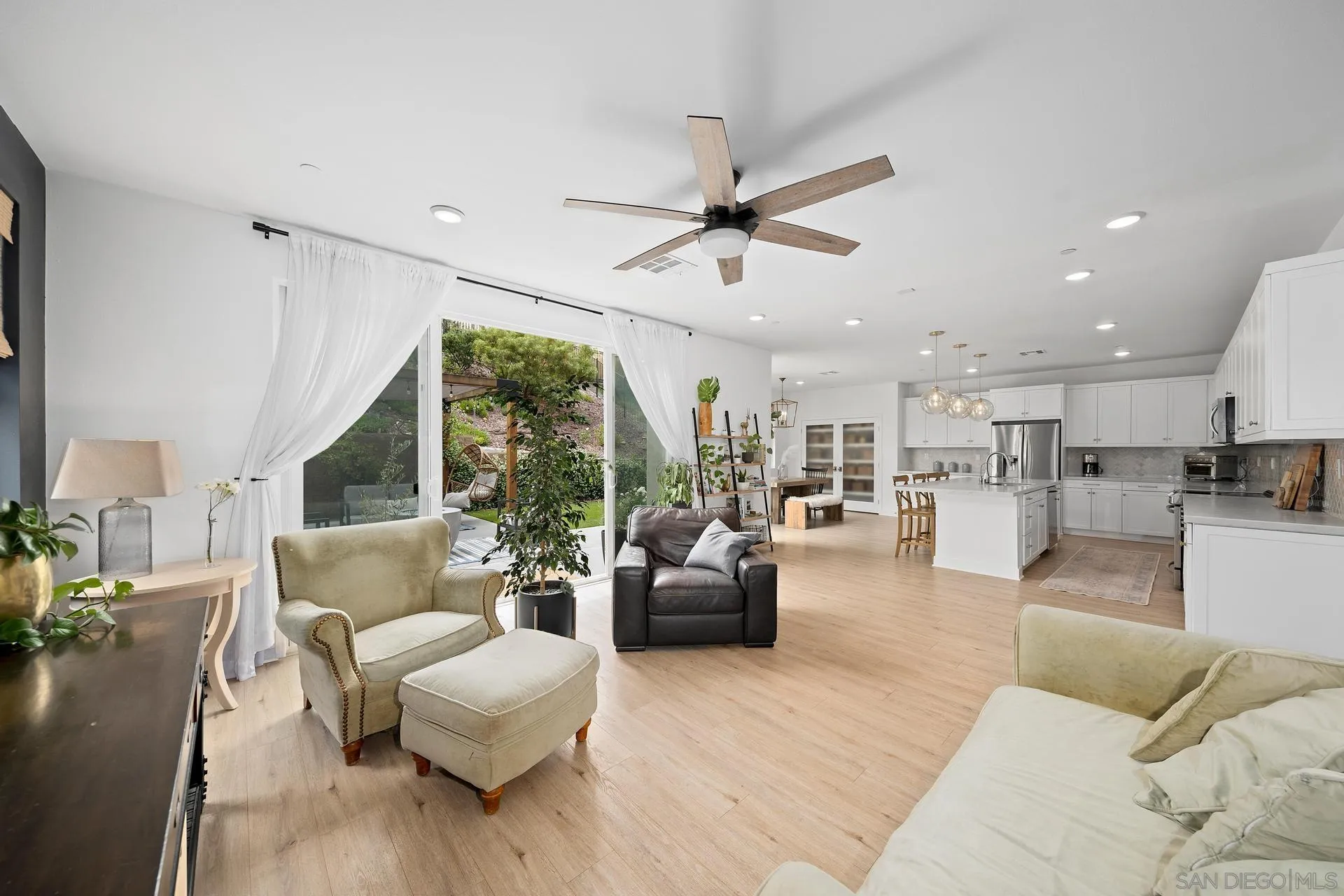 8850 Weston Road Santee, CA 92071 - Photo 12 of 44 a living room with furniture kitchen view and a large window