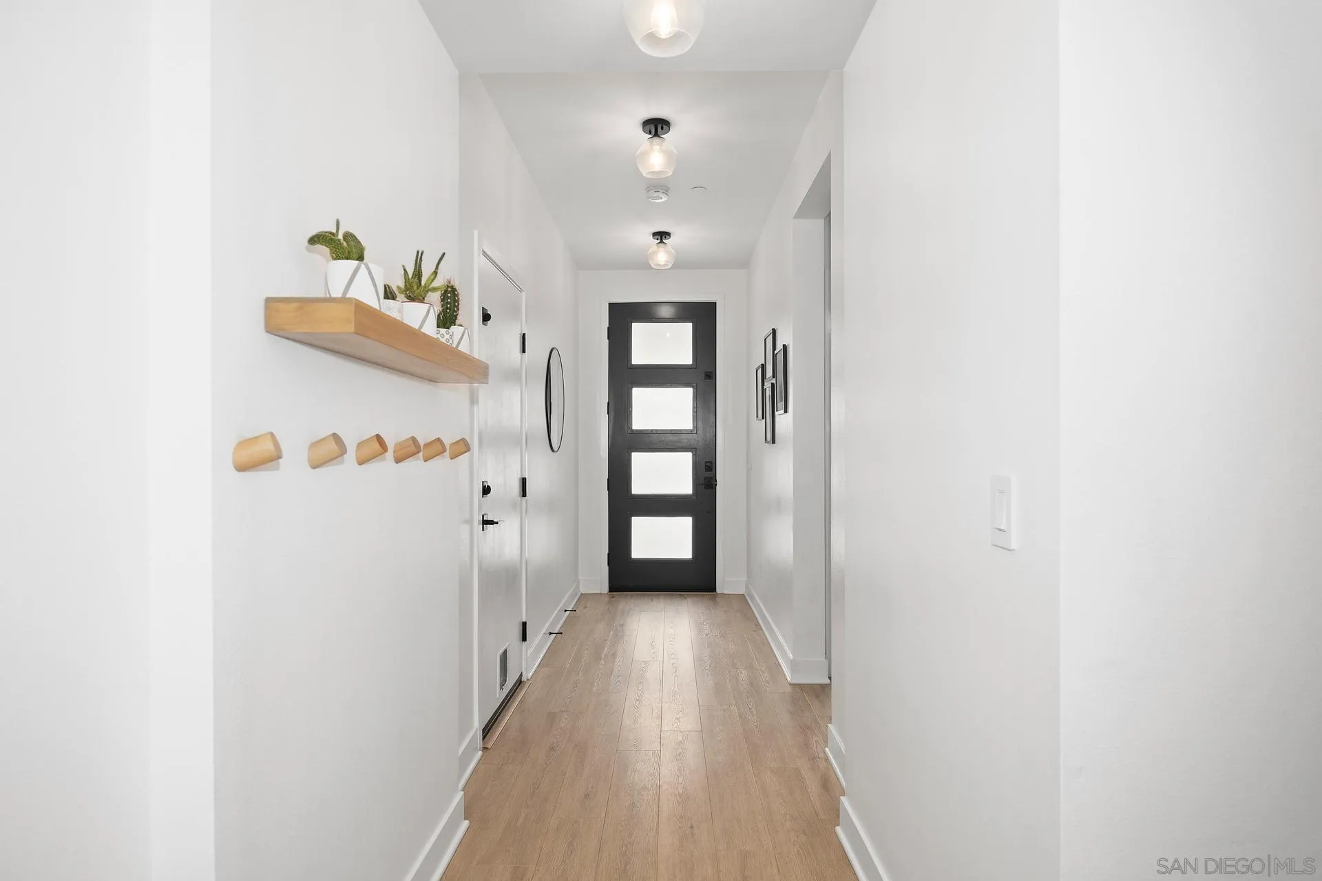 8850 Weston Road Santee, CA 92071 - Photo 15 of 44 a view of a hallway with wooden floor and closet