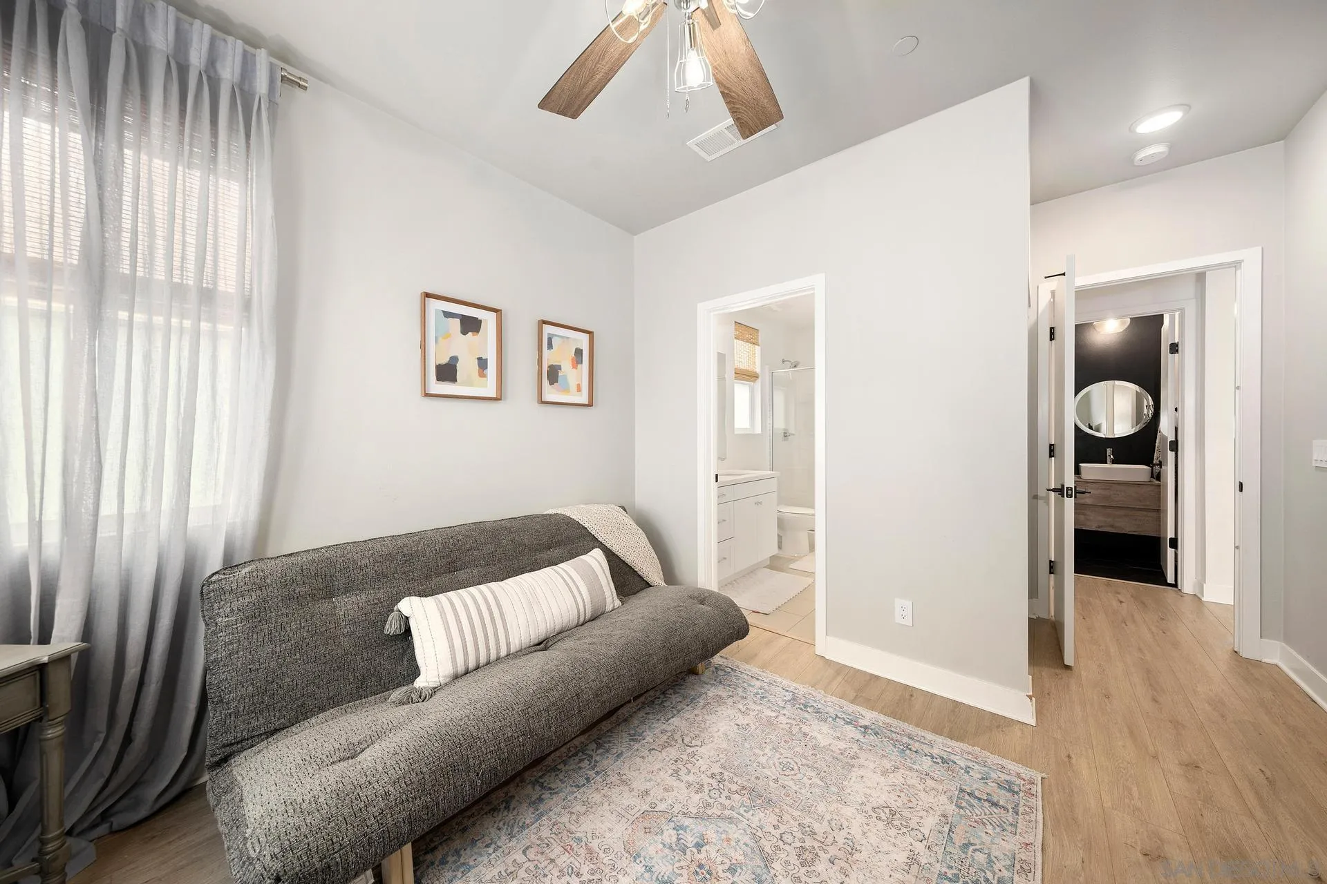 8850 Weston Road Santee, CA 92071 - Photo 16 of 44 a living room with a couch and a window