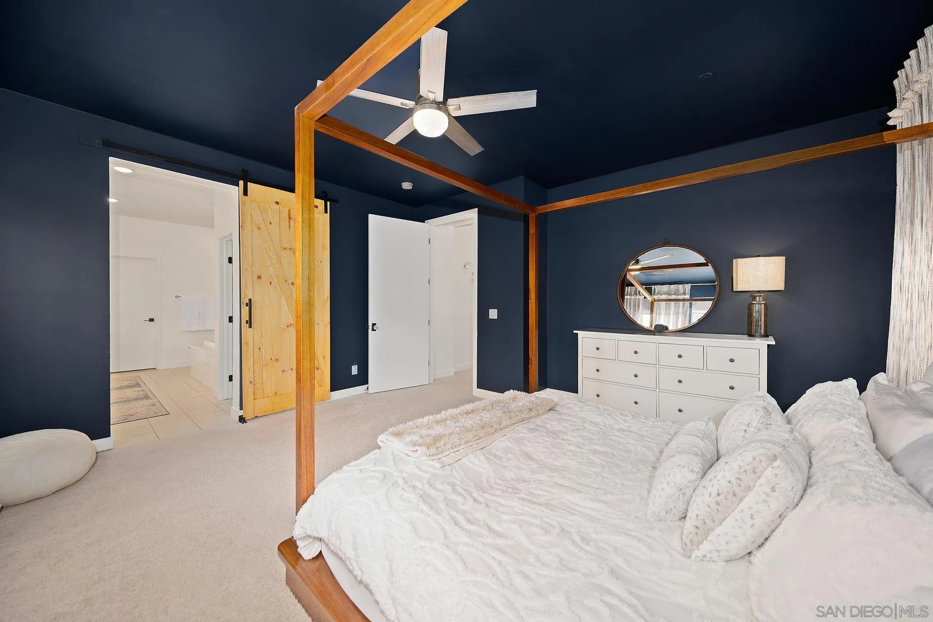 8850 Weston Road Santee, CA 92071 - Photo 23 of 44 a spacious bedroom with a bed and a large mirror