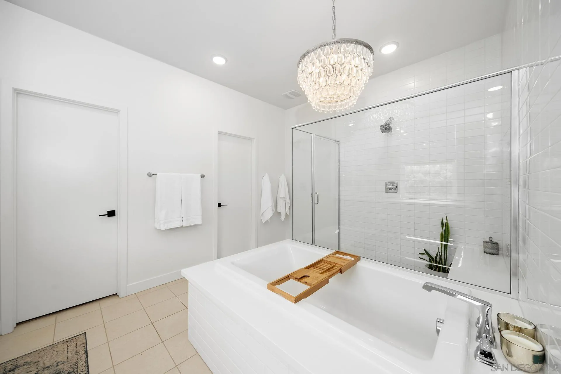 8850 Weston Road Santee, CA 92071 - Photo 24 of 44 a spacious bathroom with a sink a large mirror and shower