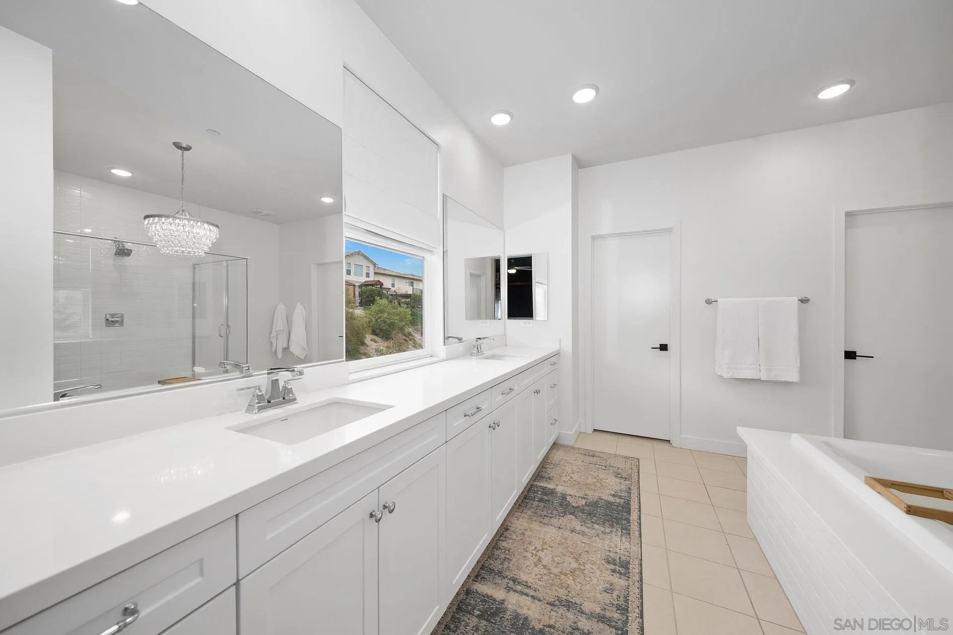 8850 Weston Road Santee, CA 92071 - Photo 26 of 44 a large bathroom with a large tub sink and vanity