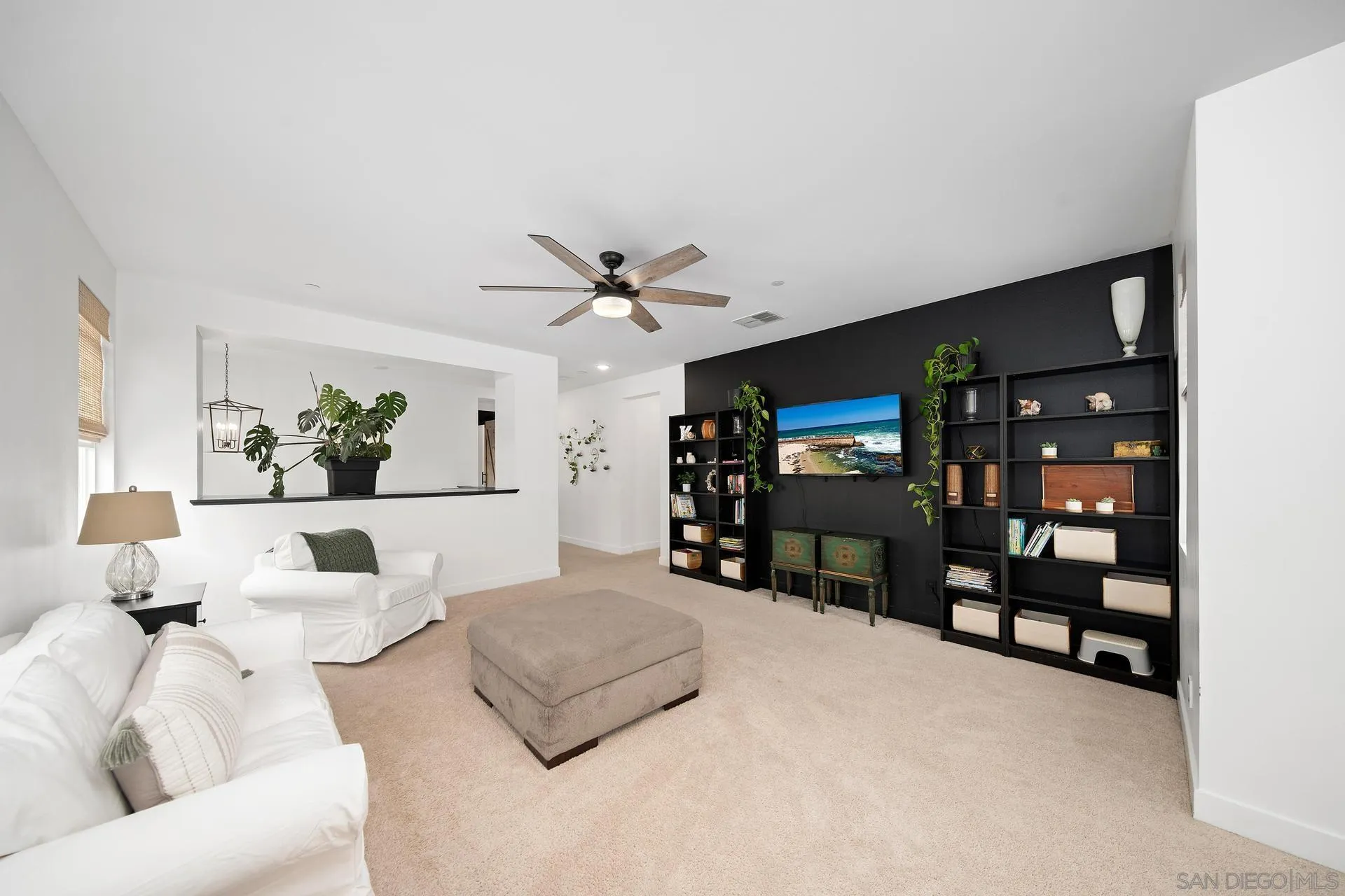 8850 Weston Road Santee, CA 92071 - Photo 27 of 44 a living room with furniture and a flat screen tv