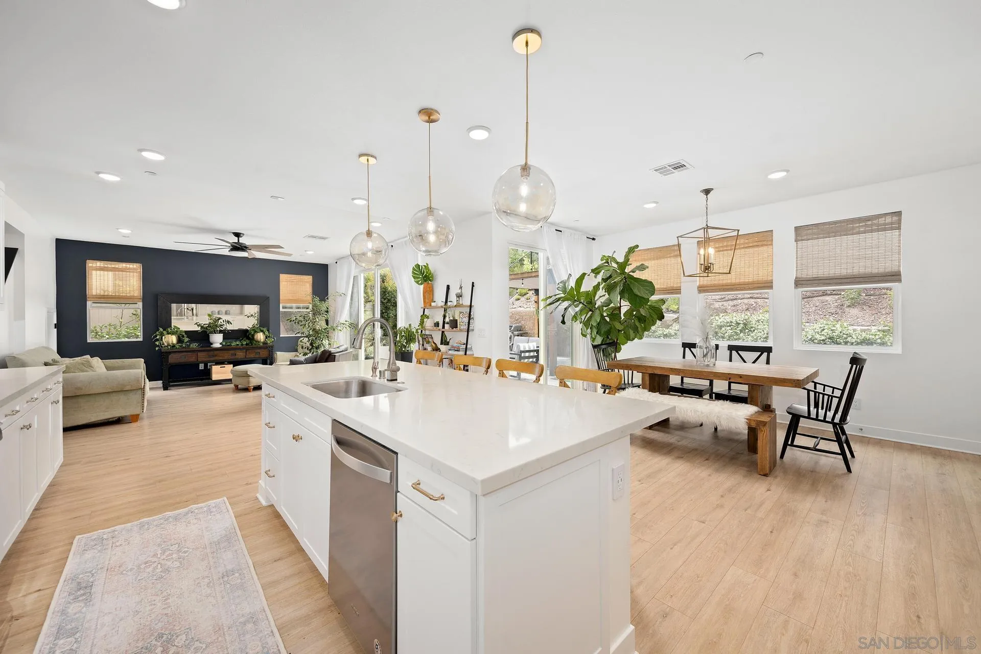 8850 Weston Road Santee, CA 92071 - Photo 3 of 44 a view of kitchen with stainless steel appliances kitchen island living room and living room
